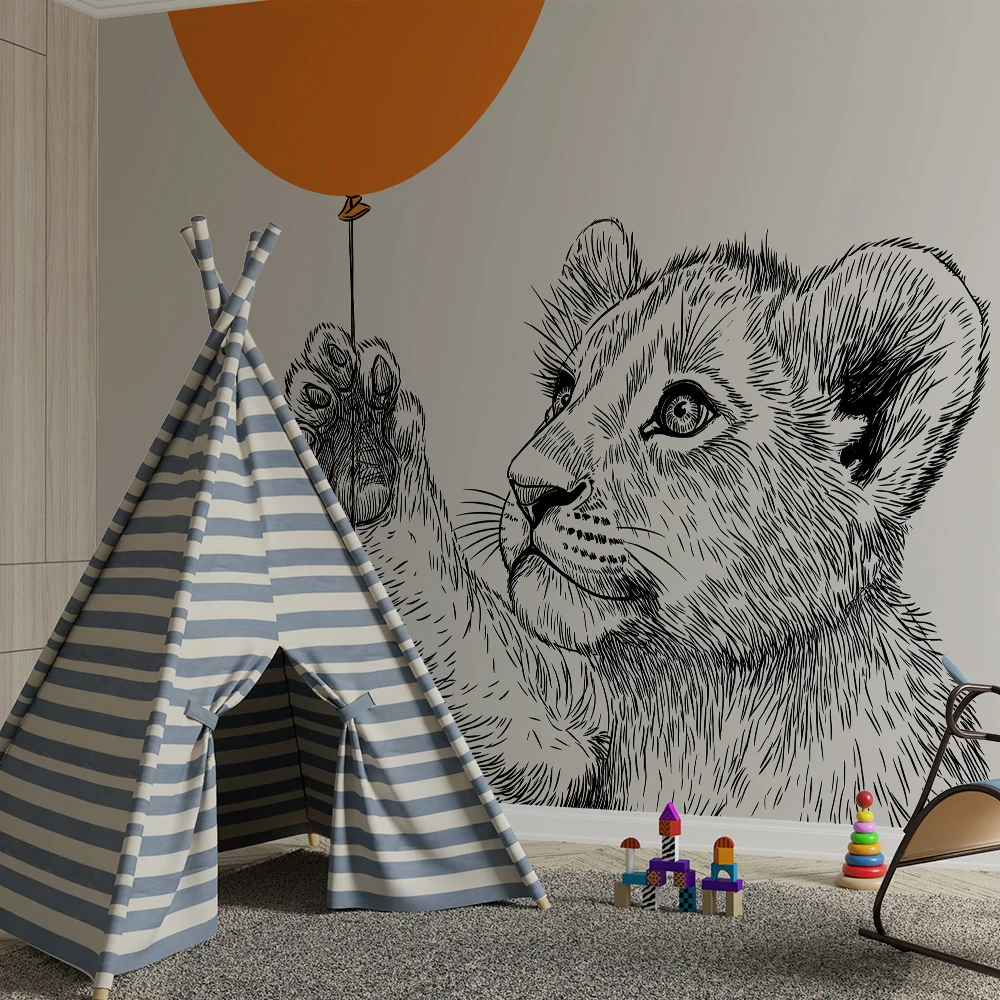 Barnetapet med liten løve og oransje ballong