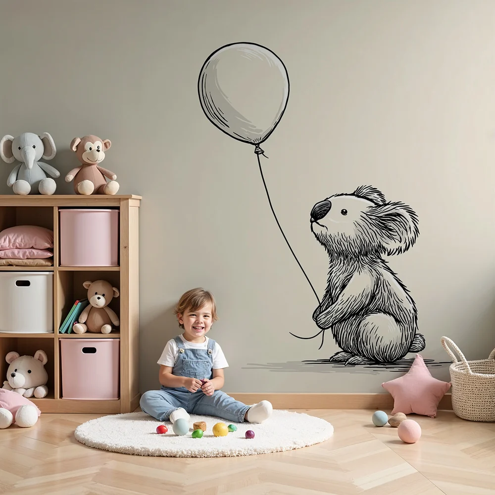 Tapet barnerom | Liten koala som holder en ballong i en myk setting